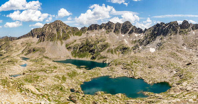 Panoramic view of the lakes Lac Deth Cap de Colomers and Estanh de Ratera with the Gran Tuc de Colomers mountain in the background, in the Circ de Colomers, province of Lleida, Catalonia, Spain


