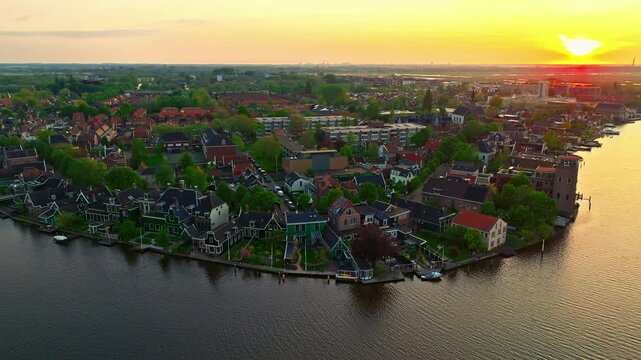 Aerial view of windmills at famous tourist site Zaanse Schans in Holland on sunset. Zaandam, Netherlands