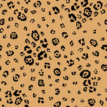 Seamless leopard animal print pattern with scattered spots