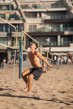 young man playing footvolley in Las Canteras beach. Las Palmas de Gran Canaria. Canary Islands. Spain.