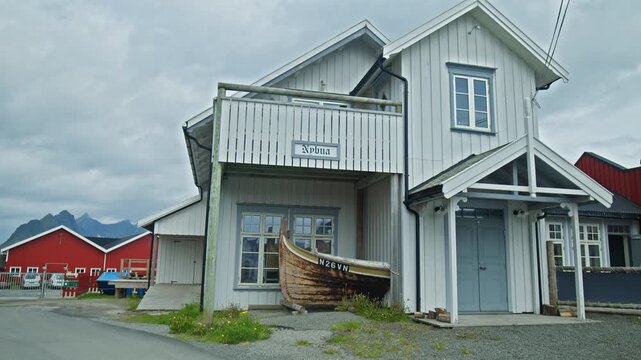 White wooden building at stockfish in Lofoten, Norway. Traditional coastal architecture with fishing heritage and scenic Nordic village setting.