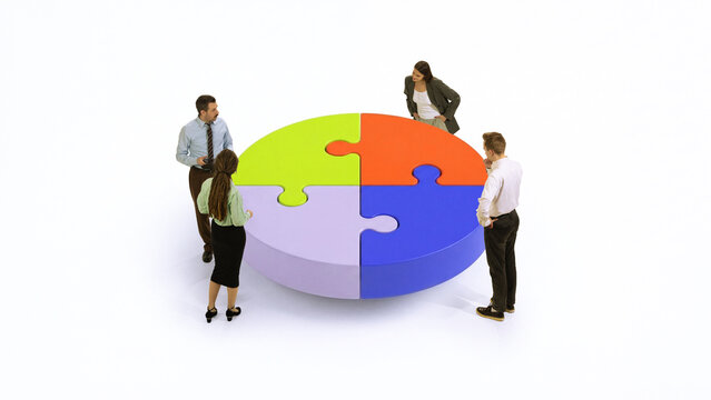 Team analyzing puzzle chart representing collaboration strategy and business planning. Concept of problem solving, integrated business solutions, communication process and corporate decision making