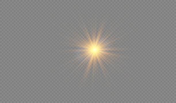 Bright golden starburst lens flare isolated on transparent background.