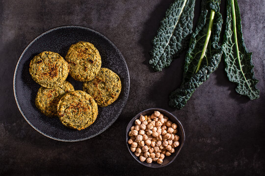 Raw vegetables on textured dark surface