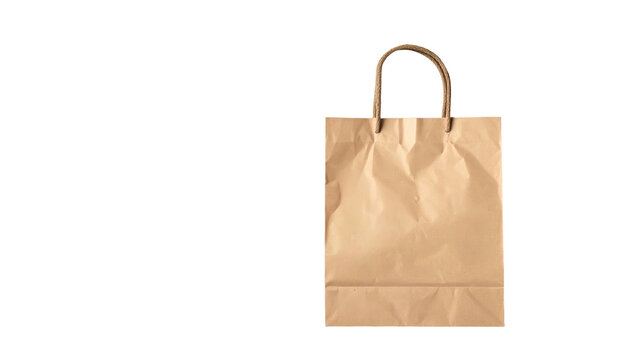 A close-up shot of a brown paper shopping bag with sturdy handles, set against a solid black background. The bag is crumpled