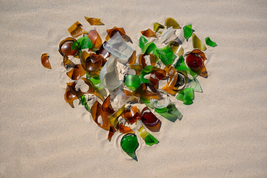 A heart made of shards of glass, roughly polished by the sea&rsquo;s currents and surf. From the fragments and shards of green, white, and brown bottles washed ashore, a symbol of love takes shape on beach