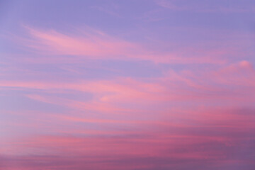 Fototapeta premium Beautiful soft gentle sunrise, sunset pink violet blue sky with clouds abstract background texture