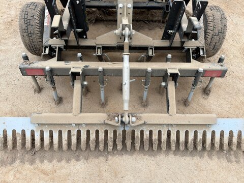 Industrial Soil Leveler: A heavy-duty steel tractor attachment designed for commercial land clearing, smoothing, and raking soil to create a flat surface.