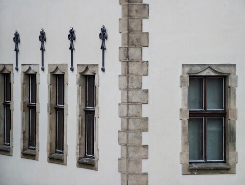 Intricate stone window designs and craftsmanship evoke timeless architectural heritage and preservation