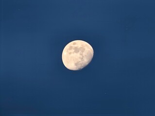 Bright moon scene. Striking portrayal of bright moon casting shadows on textured cratered surface © Vladimir
