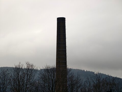 Rural landscape depiction. Tranquil scene where nature overtakes former industrial structures today