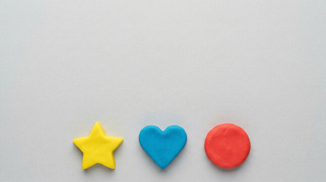 Playdough shapes on gray background