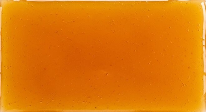 Orange marmalade texture background with small bubbles
