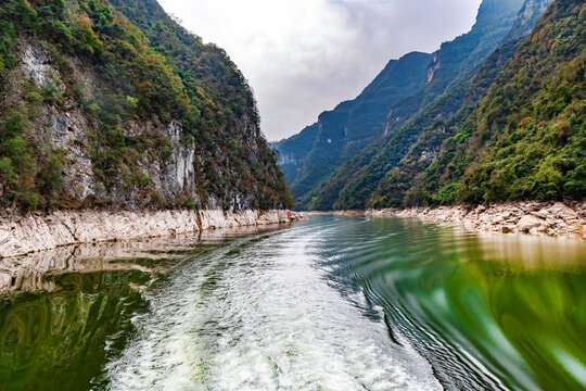 A cruise along the Yangtze River gorges in the Three Gorges region of China. Yangtze River cruises are extremely popular, offering travelers views of the steep cliffs, historical sites, and natural be