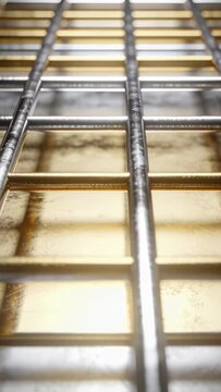 Tilting camera capturing chrome wire rack shifting focus over gold tray in kitchen to reveal wear