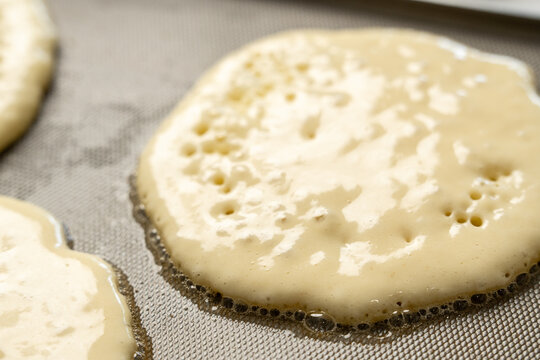 Pancakes cooking on griddle 