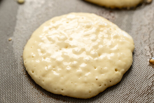 Pancakes cooking on griddle 
