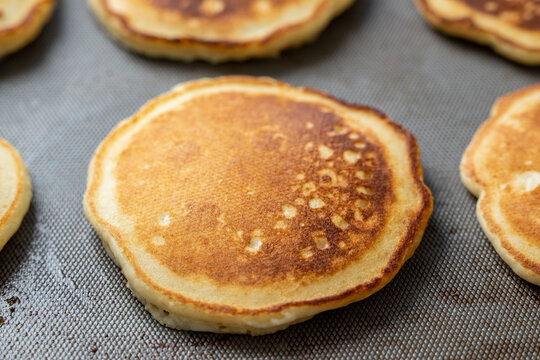 Pancakes cooking on griddle 