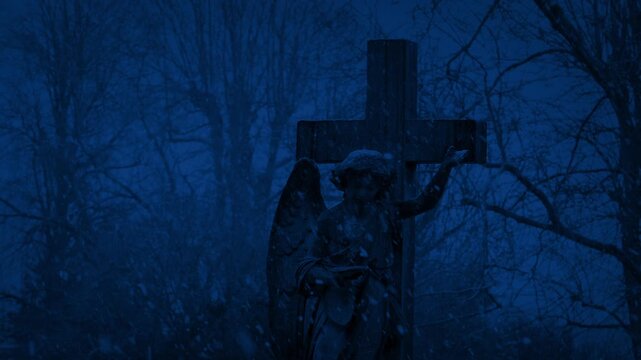 Cross Gravestone In Snowfall At Night