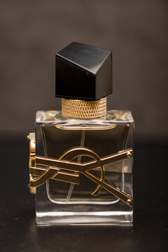 Standing upright YSL -  Yves Saint Laurent Women's Fragrance on dark background 