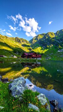 Mountain lake chalet at dawn
