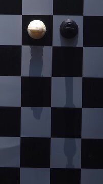 Cinematic pan over a messy chessboard of fallen pieces