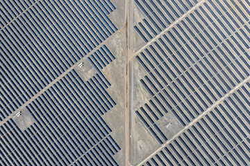 Aerial view of a huge photovoltaic park with multiple sectors of solar panels in the process of generating electricity © WILL PHOTOGRAPHY