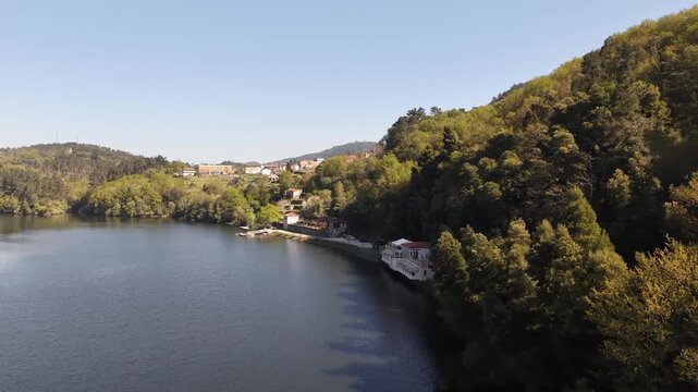 Balneario cortegada building by the river, offering health and relaxation in natural surroundings