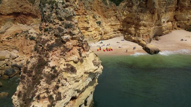Drone close-up flying near limestone cliffs showing textures, layers and ocean below. Ideal for nature documentaries and scenic visuals.
