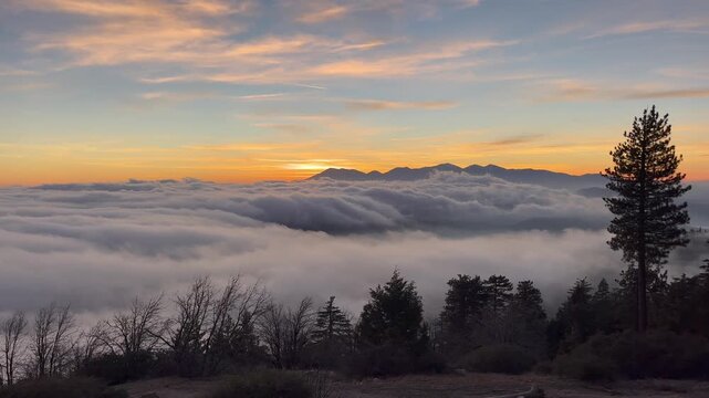 Clouds rolling over mountains at sunset time-lapse. San Bernardino National Forest