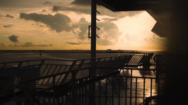 Aerial view of sunset in Labuan Bajo harbour with luxury cruise boats, vacation in Indonesia in Komodo national park, exotic tropical port of Labuan Bajo