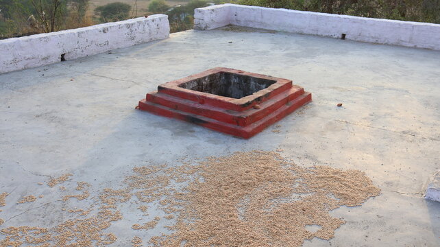 Havan Kund and Drying Grain on a Rooftop, India