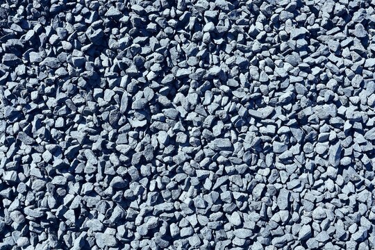 Anthracite basalt stones in top view. Stone background. Basalt split.