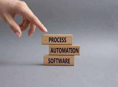 Process Automation Software symbol. Concept word Process Automation Software on wooden blocks. Businessman hand. Beautiful grey background. Business and Process Automation Software. Copy space