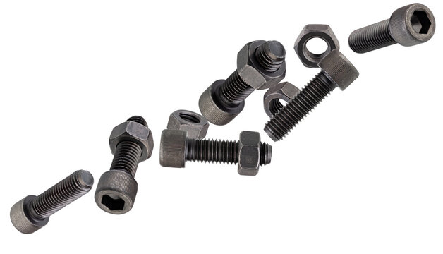 Black, hardened round-head bolts for a special internal Allen key fly through space forming a chain shape. Isolated on white