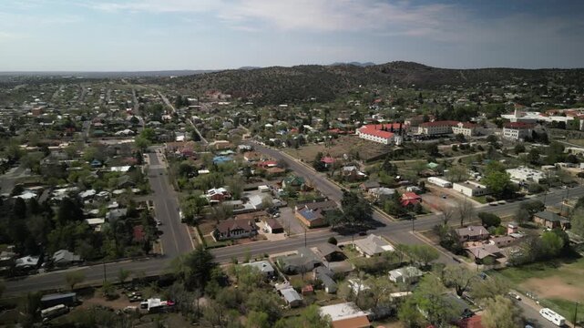 Aerial above small town Silver City New Mexico historic silver mining town in spring