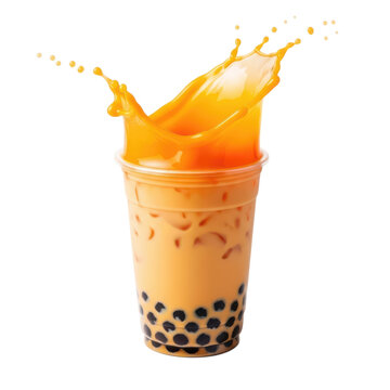 A tall glass of boba tea with a splash of orange liquid overflowing from the top.