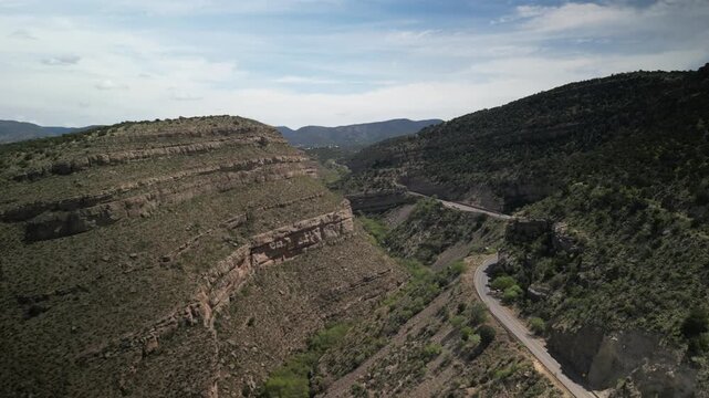 Aerial above canyon and Fresno Creek on Highway 82 New Mexico in high desert near High Rolls