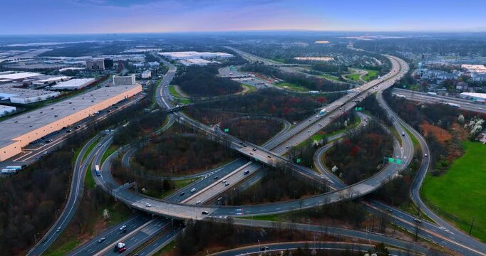 Motorways, loops and trestles in the wooded area. Approaching a huge interchange in New York suburbs.