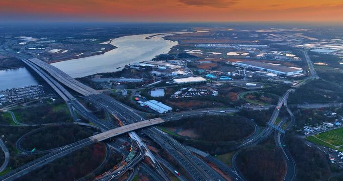 Interchange in the woods near the river. Commuting in the suburbs of New York, USA. Aerial view.