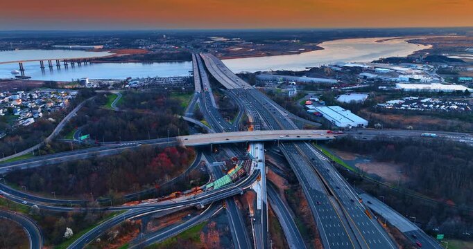 Distancing from the Raritan River with Driscoll bridge and the Edison Bridge across it. Moving over the large interchange in New Jersey, USA.