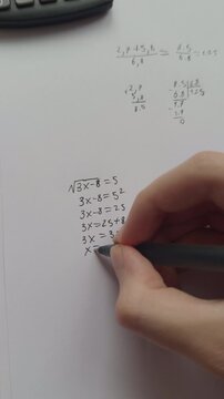 A student doing math. Close up.