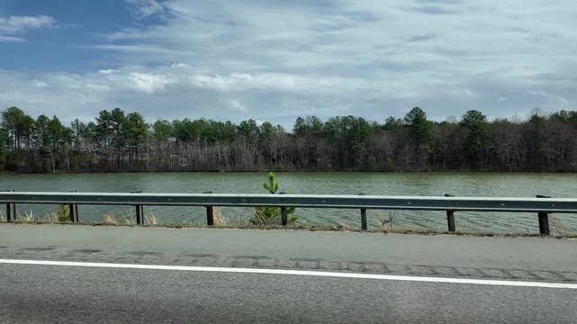 Driving on a Bridge Over Water in North Carolina During the Day