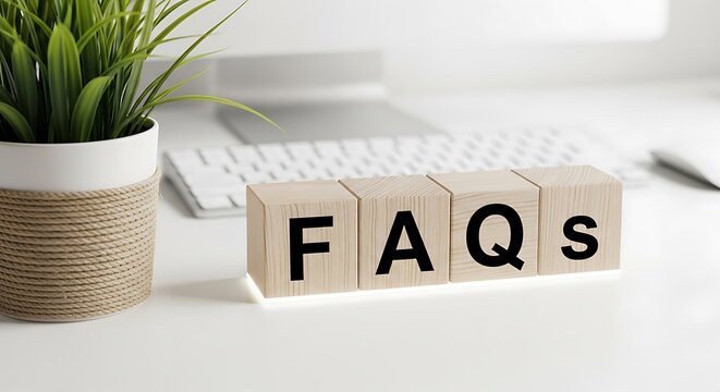 Fa qs frequently asked questions text on wooden blocks in office workspace setting with customer service