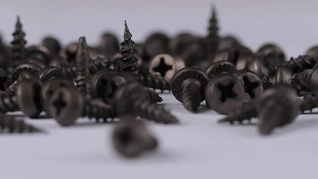 Metal screws for fastening equipment. Soft focus. Close-up. 