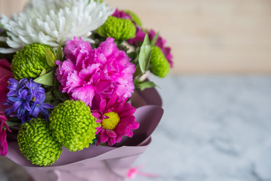Absolutely gorgeous, multicoloured bouquet in a flower box on marble background.soft pastel floral composition for mother day celebration greeting and holiday. copy space