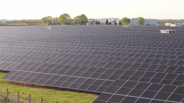 Drone Aerial View of Solar Farm Panels at Sunset Power Generation Site