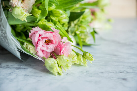 Celebrate special occasions with a colorful summer bouquet featuring fresh roses, eustoma blooms, creating an elegant and fragrant floral arrangement. love concept. copy space