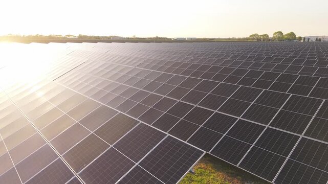 Aerial Drone Footage of Solar Power Farm Photovoltaic Array at Dusk