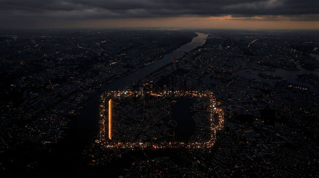 Aerial view shows dark city during blackout with lights forming battery icon shape across urban landscape. Energy security, power grid, urban sustainability, climate resilience.